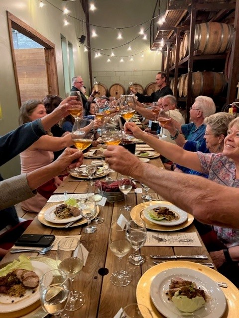 People celebrating in the Madrona cellar.